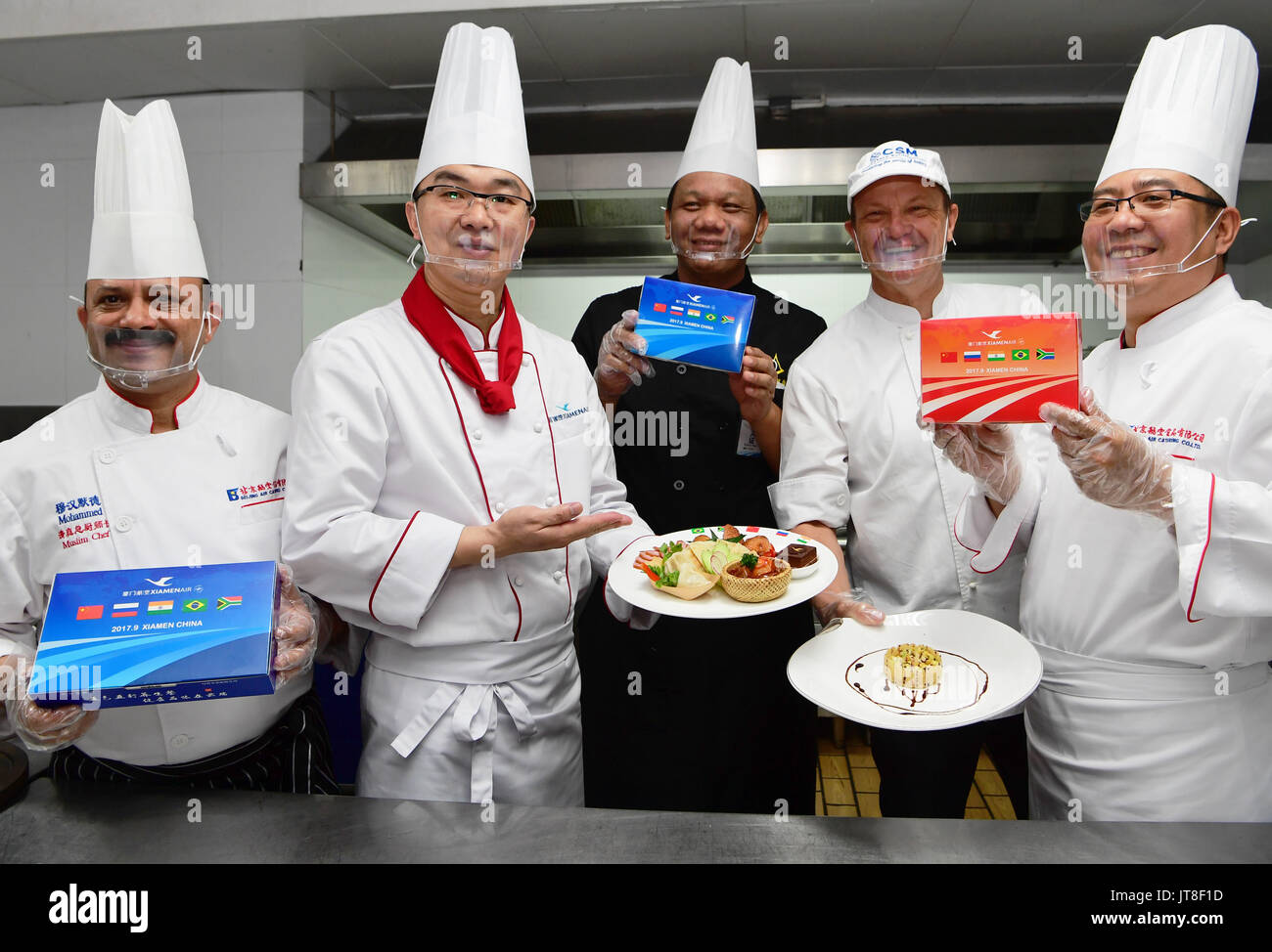 Xiamen, China's Fujian Province. 8th Aug, 2017. Chefs show the in-flight meal specially made for the upcoming BRICS Summit during a food festival of Chinese airline XiamenAir in Xiamen, southeast China's Fujian Province, Aug. 8, 2017. The meal is a mixture of food from five BRICS countries -- Brazil, China, India, Russia and South Africa. In September, China will host the 9th BRICS Summit in the coastal city of Xiamen. Credit: Wei Peiquan/Xinhua/Alamy Live News Stock Photo