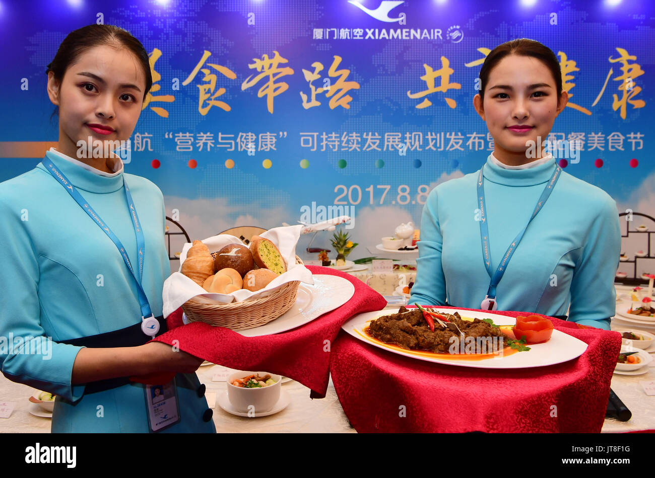Xiamen, China's Fujian Province. 8th Aug, 2017. Staff members show in-flight meal during a food festival of Chinese airline XiamenAir in Xiamen, southeast China's Fujian Province, Aug. 8, 2017. In September, China will host the 9th BRICS Summit in the coastal city of Xiamen. Credit: Wei Peiquan/Xinhua/Alamy Live News Stock Photo