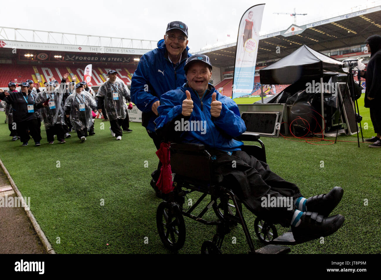 Sheffield, UK. 8th August, 2017. UK Special Olympics Opening Ceremony in Sheffield on August 8, 2017. Thousands of people cheering while the regional teams are presented in heavy rain. Credit: Dominika Zarzycka/Alamy Live News Stock Photo