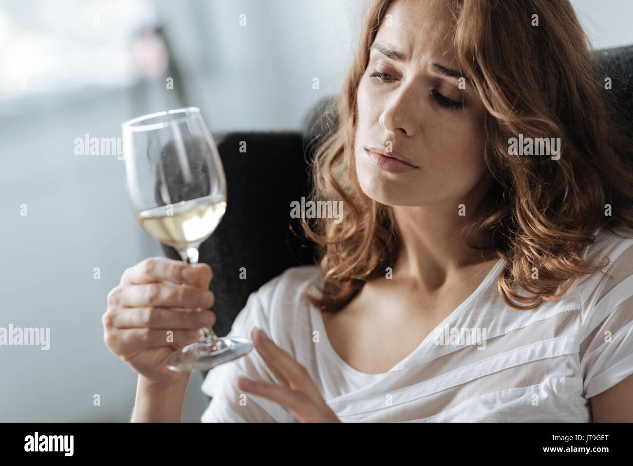 Woman looking glass wine sad hi-res stock photography and images - Alamy