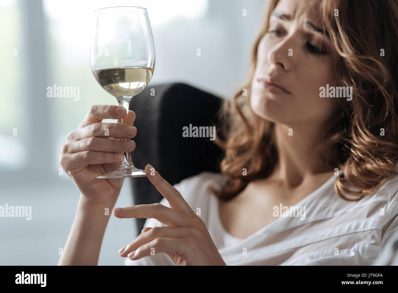 Woman glass wine sad hi-res stock photography and images - Alamy