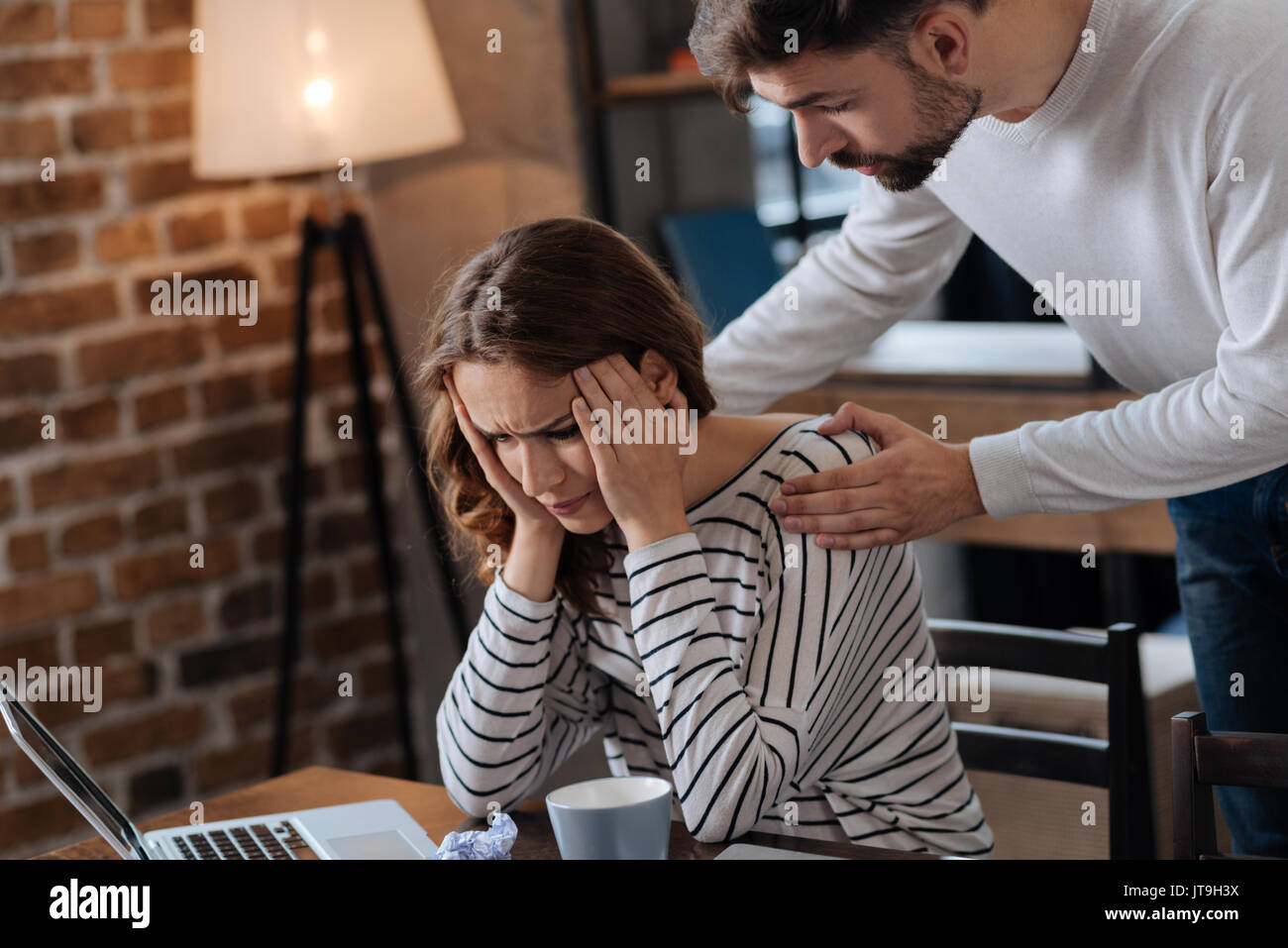 Handsome nice man comforting his girlfriend Stock Photo - Alamy