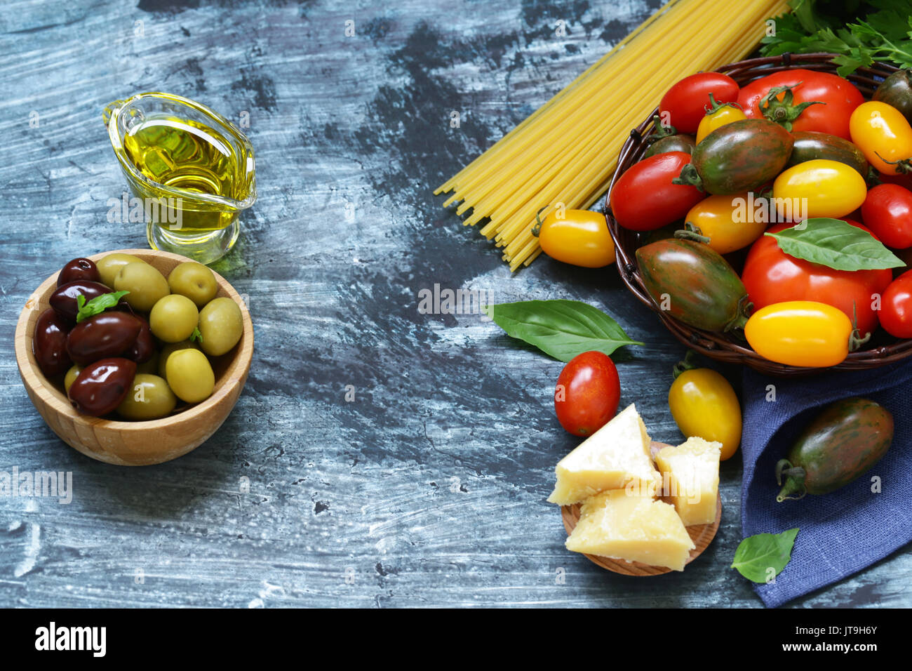 Ripe organic tomatoes in a wicker basket Stock Photo - Alamy