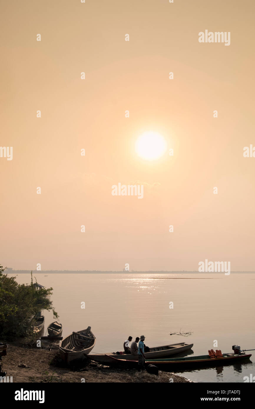 Fishing boats at dawn on the Mekong River near Kratie in Cambodia, Indochina, Southeast Asia, Asia Stock Photo
