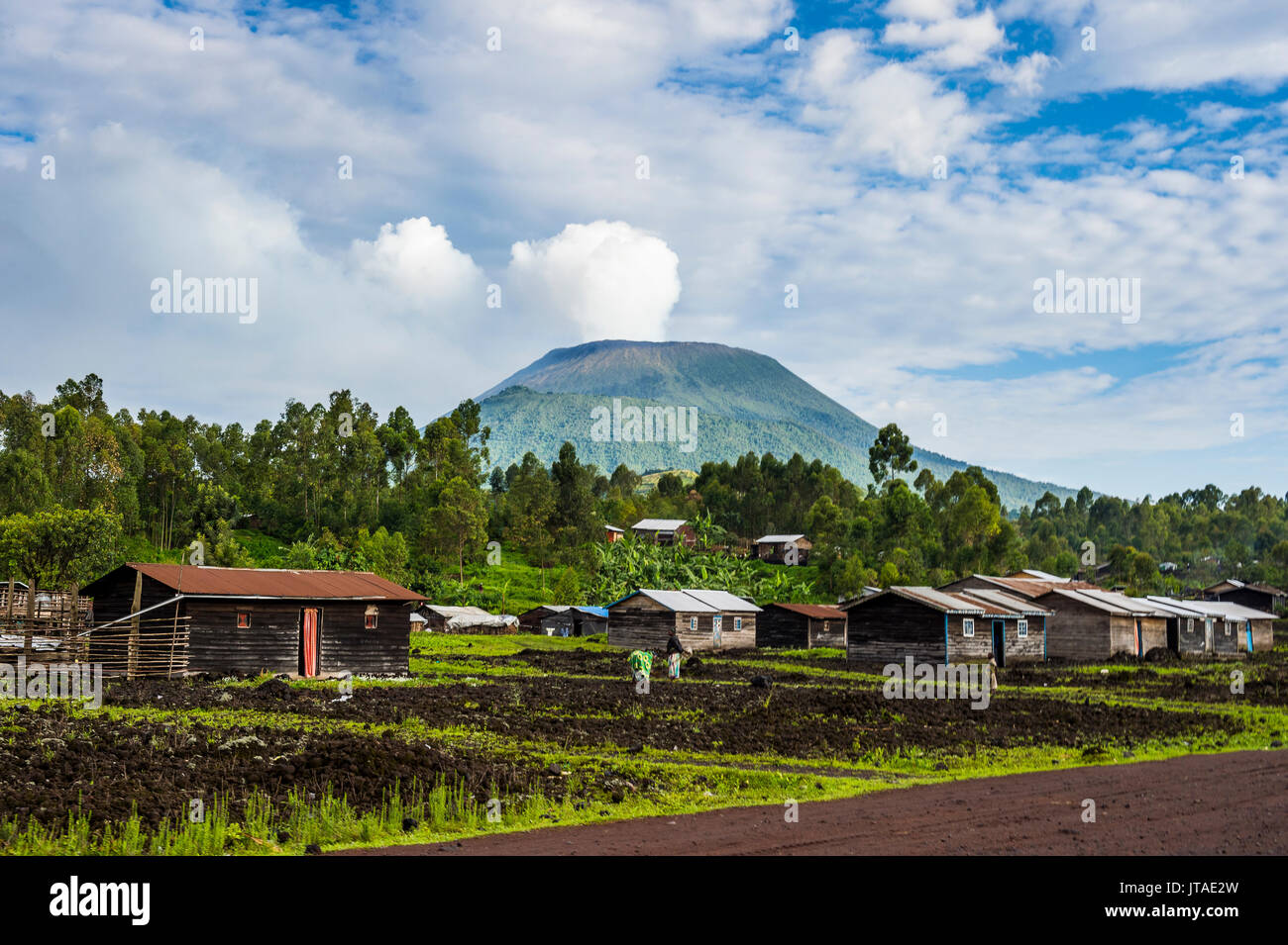 Mount Nyiragongo looming behind the town of Goma, Democratic Republic of the Congo, Africa Stock Photo