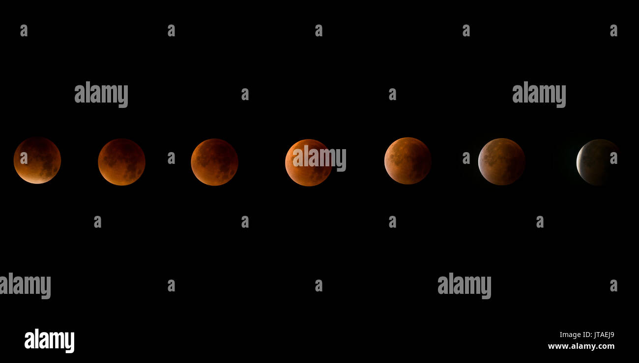 Lunar eclipse, a rare supermoon, blood moon composite phase in the night sky, United Kingdom, Europe Stock Photo