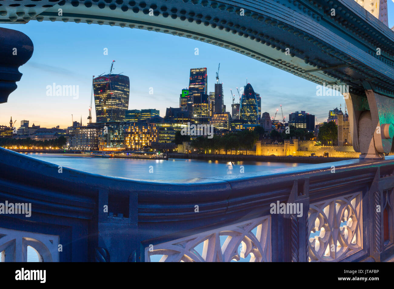 View of City of London skyline from Tower Bridge at dusk, London, England, United Kingdom, Europe Stock Photo