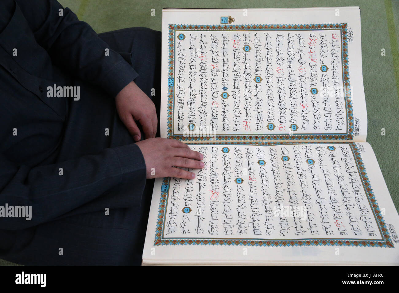 Imam reading the Quran in a mosque, Seine-e-Marne, France, Europe Stock Photo