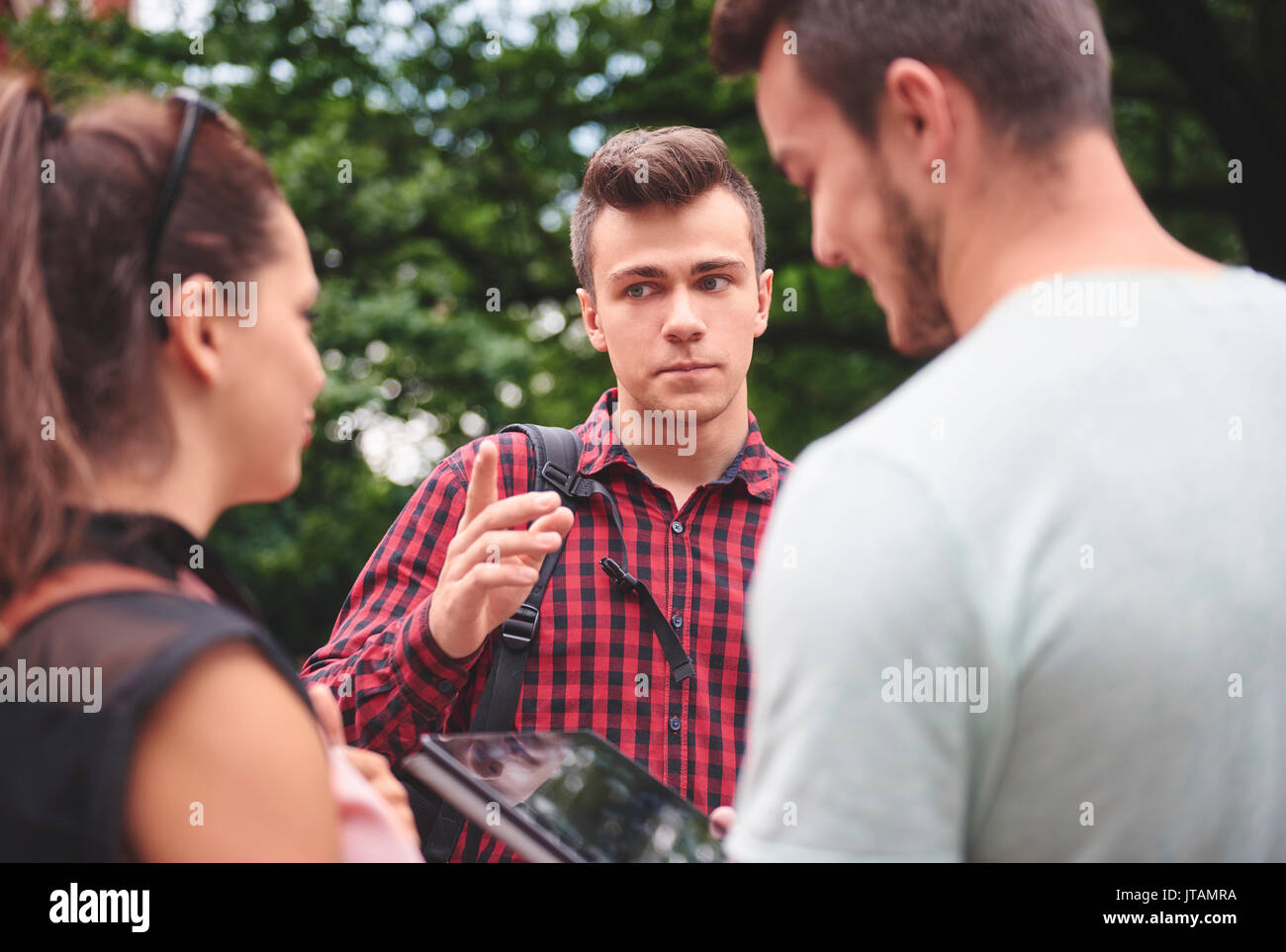 Angry man talking seriously outdoors Stock Photo