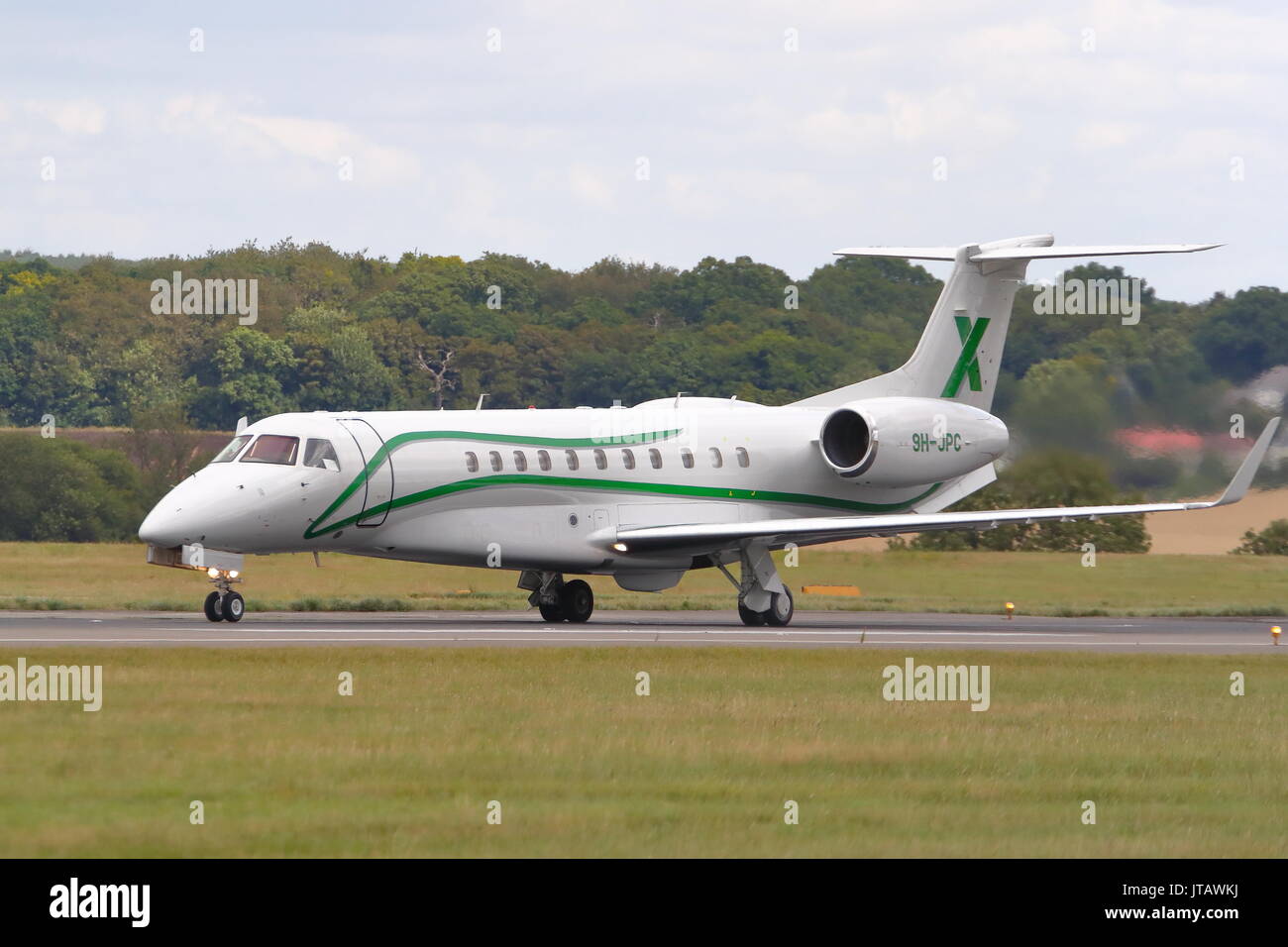Air X Embraer Legacy 600 9H-JPC taking off from London Luton Airport, UK Stock Photo