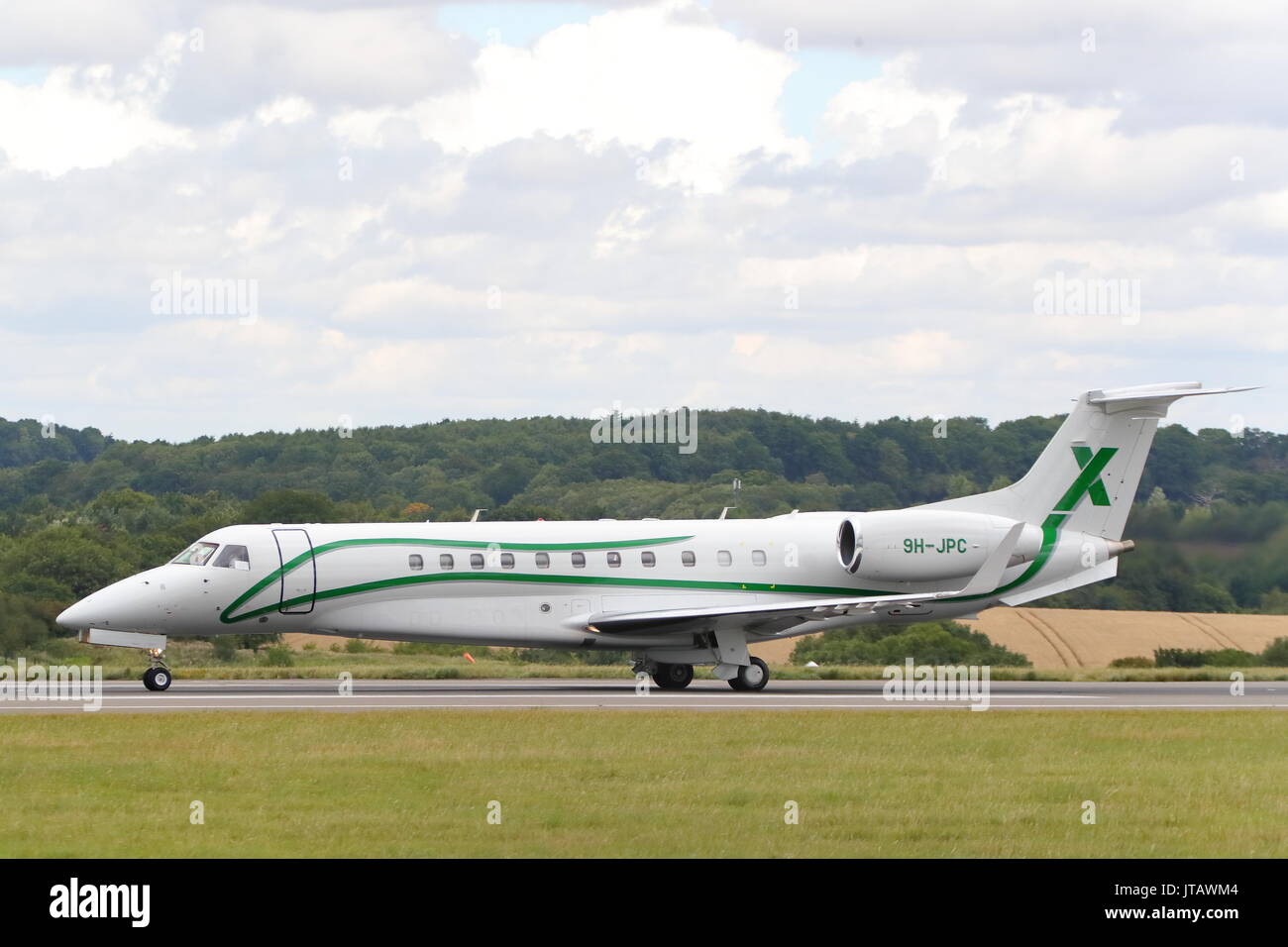 Air X Embraer Legacy 600 9H-JPC taking off from London Luton Airport, UK Stock Photo