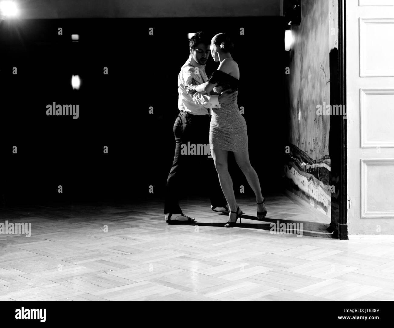 Beautiful dancers performing an argentinian tango dance. Black and white image for more effect. Stock Photo
