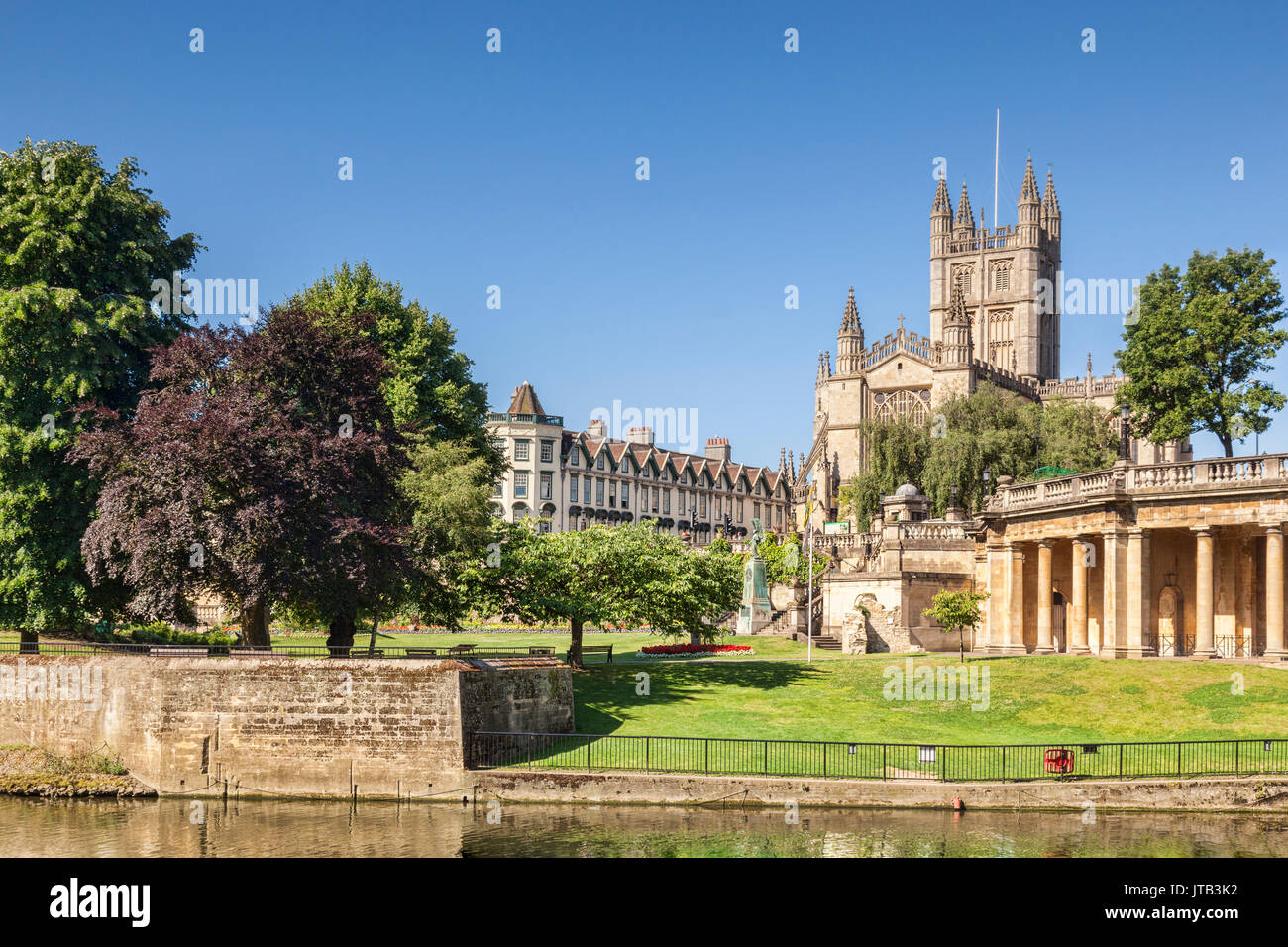 Bath Abbey and the Orangerie on the banks of the River Avon, on a beautiful summer morning with perfectly clear blue sky. Bath, Somerset, England, UK Stock Photo