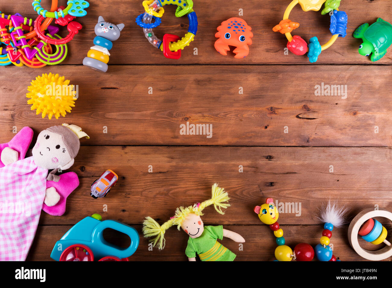 group of baby toys on wooden background with copy space. top view Stock Photo