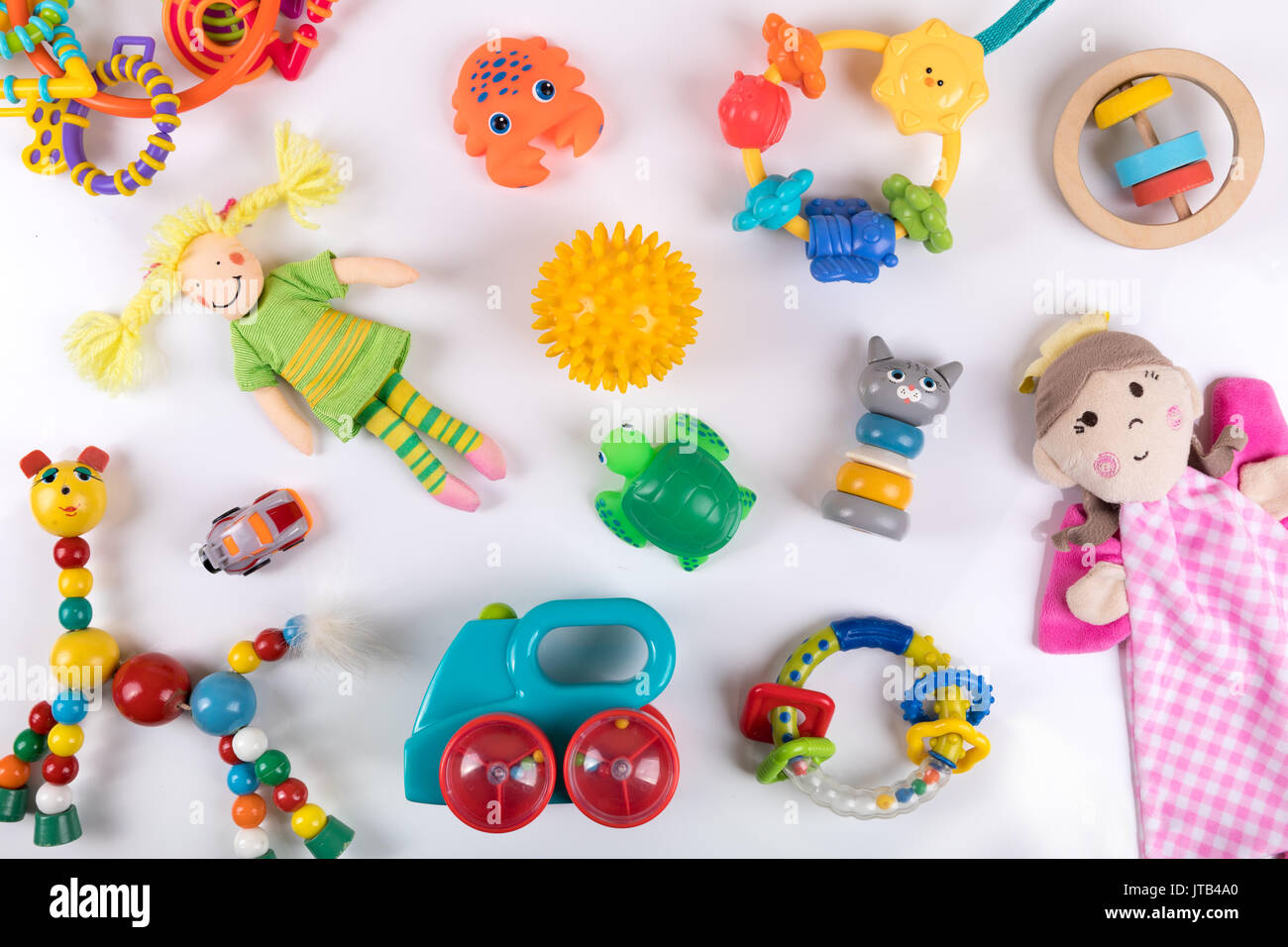 variety of colorful baby toys on white. top view Stock Photo