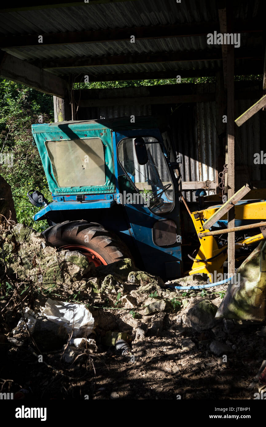 old tractor in Devon barn Stock Photo