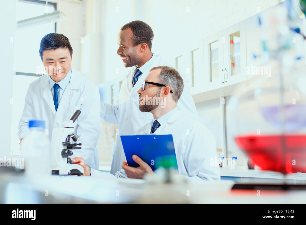 young doctors in uniform working at testing laboratory, laboratory