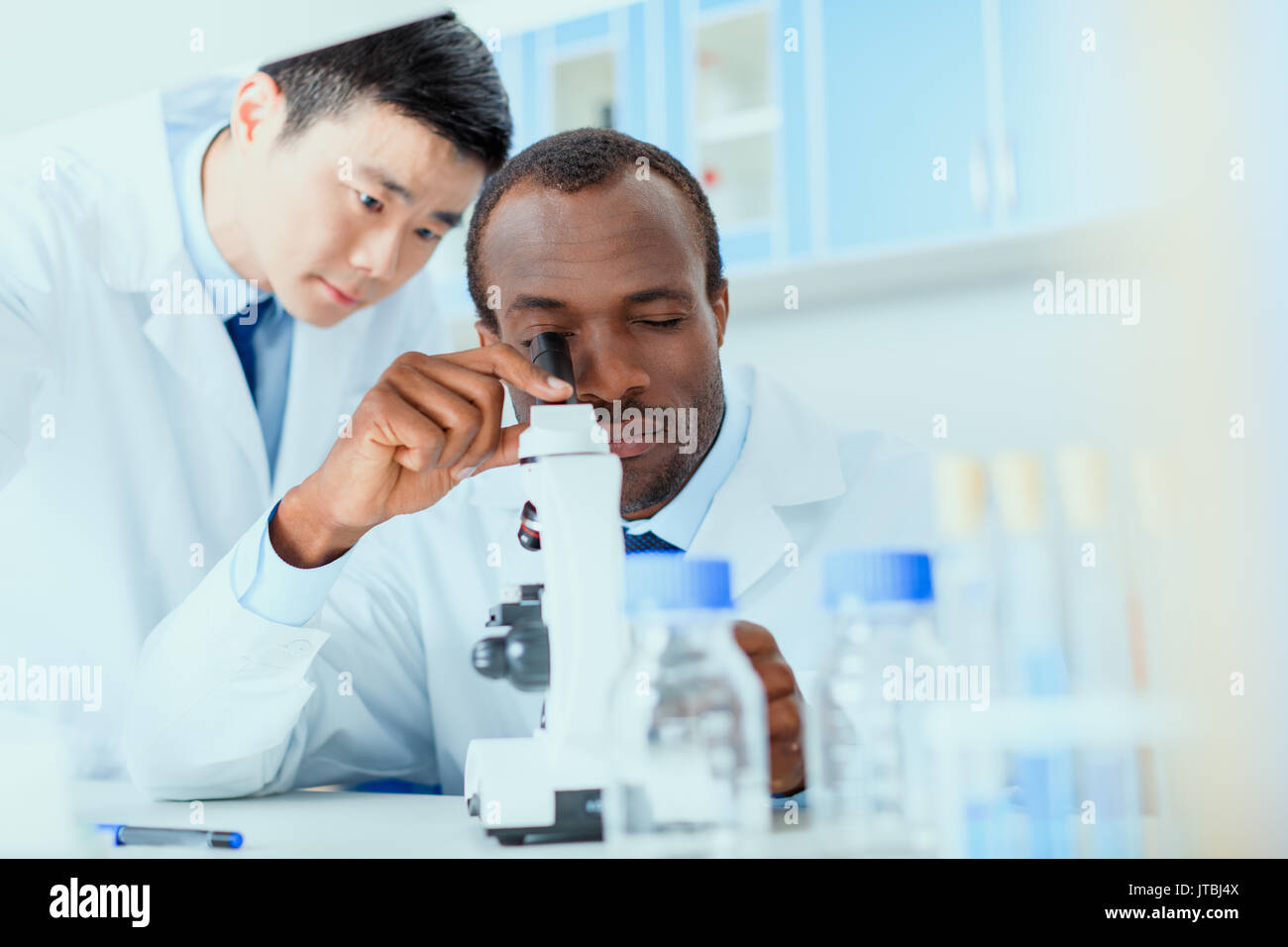 young doctors in uniform working at testing laboratory, laboratory technicians Stock Photo