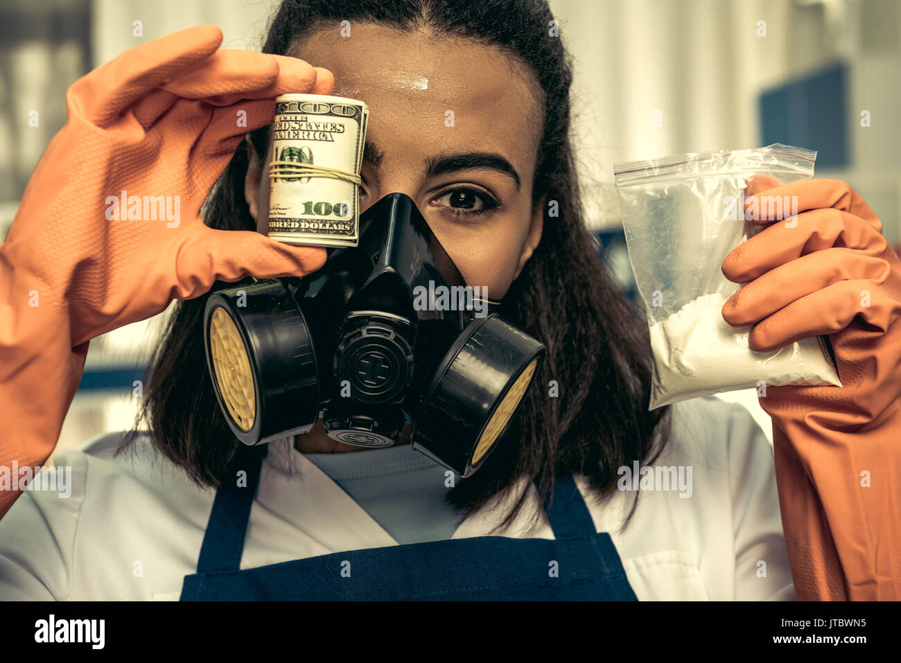 young girl laboratory technician in personal protective equipment