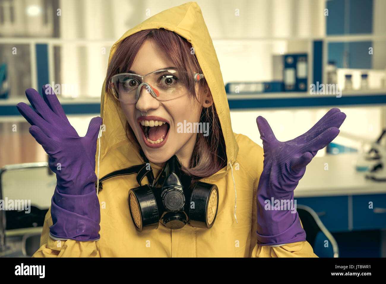 young girl laboratory technician in personal protective equipment