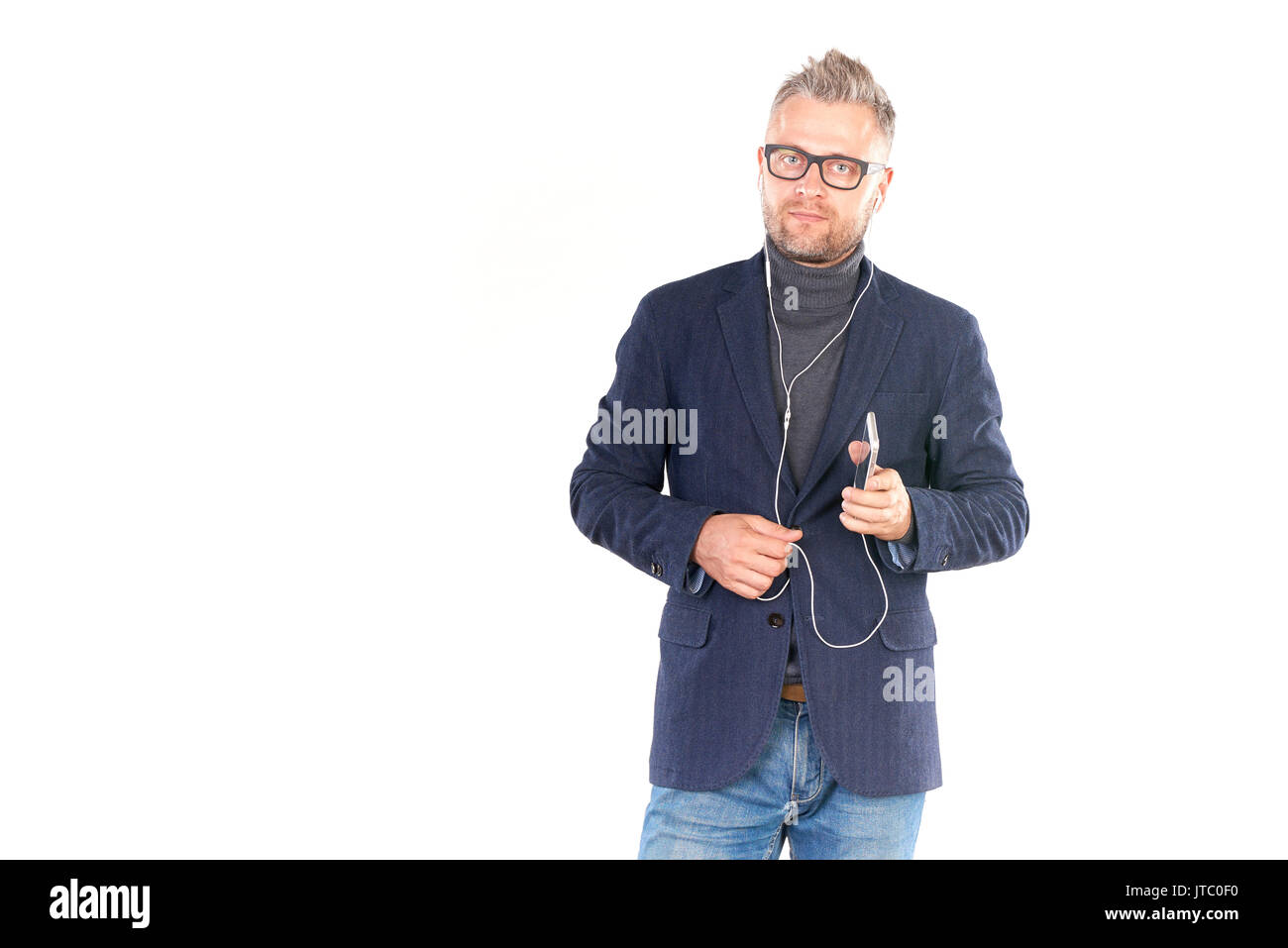 Listening to music on smartphone Stock Photo