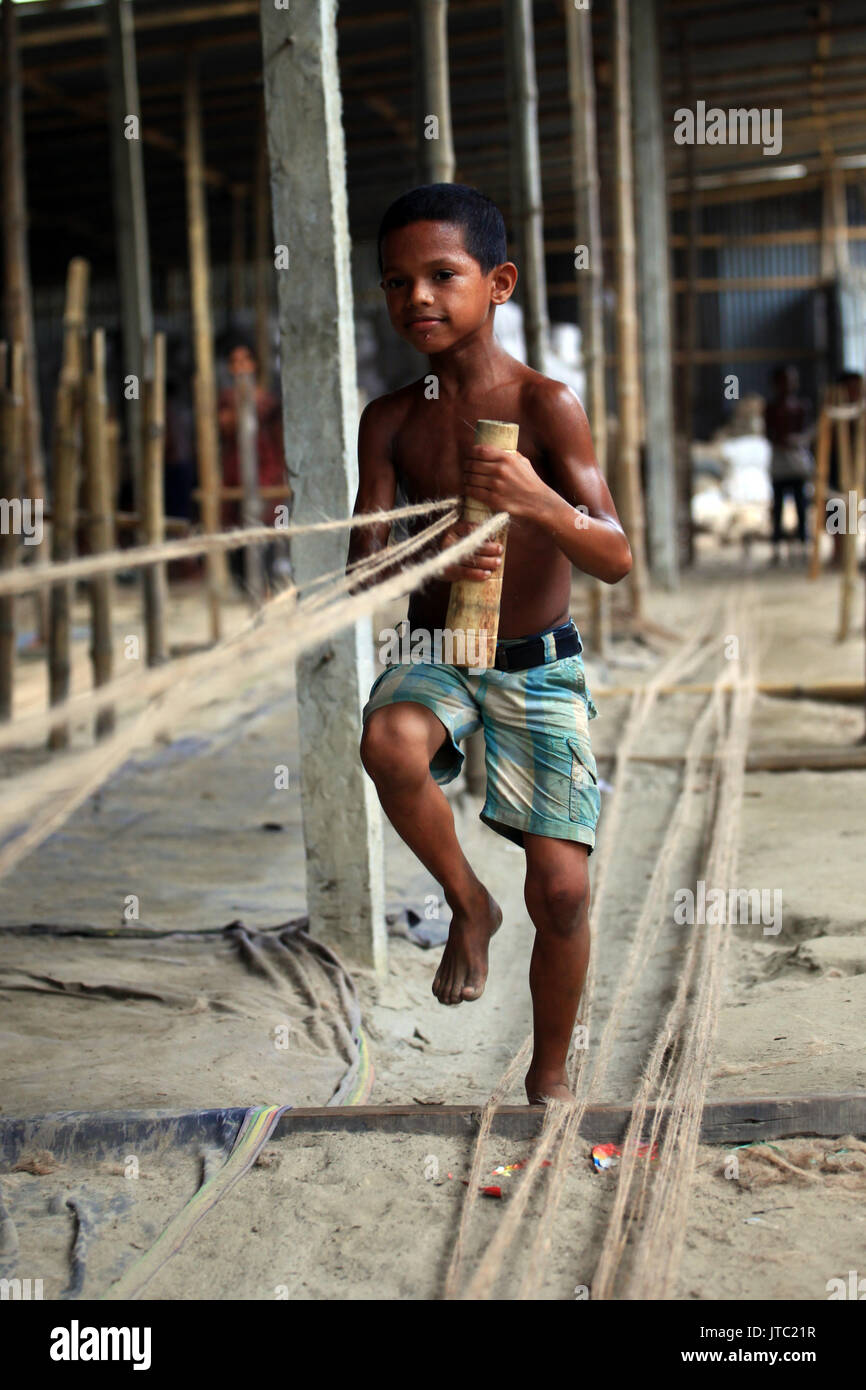 Child labours working in a rope manufacturing factory at Keraniganj in Dhaka on June 09, 2013