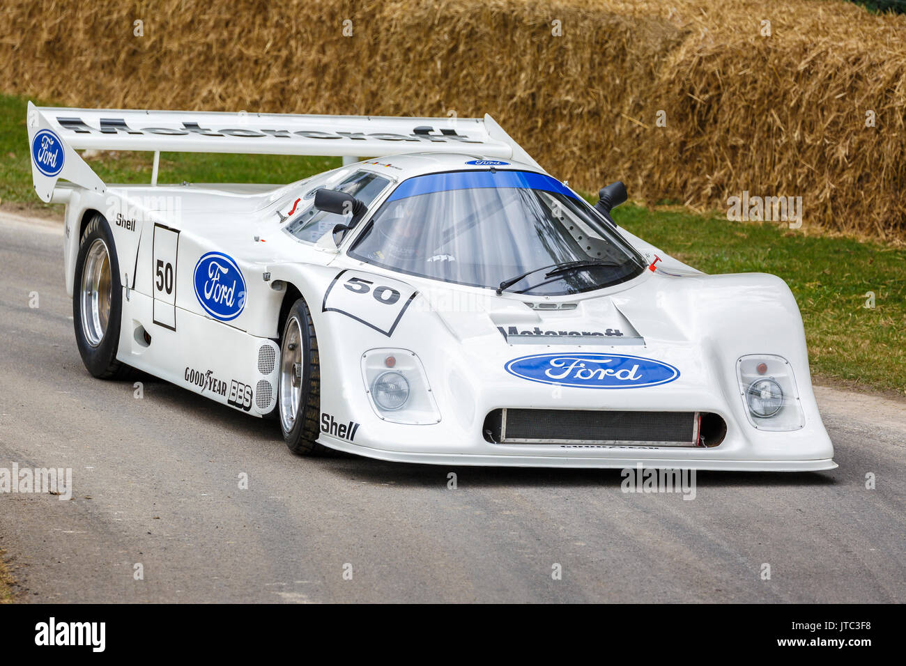 1982 Ford C100os Cosworth endurance racer with driver Martin Birrane at the 2017 Goodwood Festival of Speed, Sussex, UK. Stock Photo