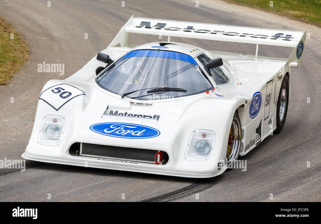 1982 Ford C100os Cosworth endurance racer with driver Martin Birrane at the 2017 Goodwood Festival of Speed, Sussex, UK. Stock Photo