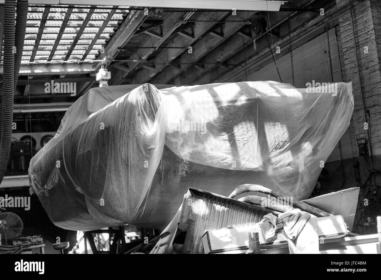 A Classic vintage American car on the lift in a repair shop Stock Photo ...