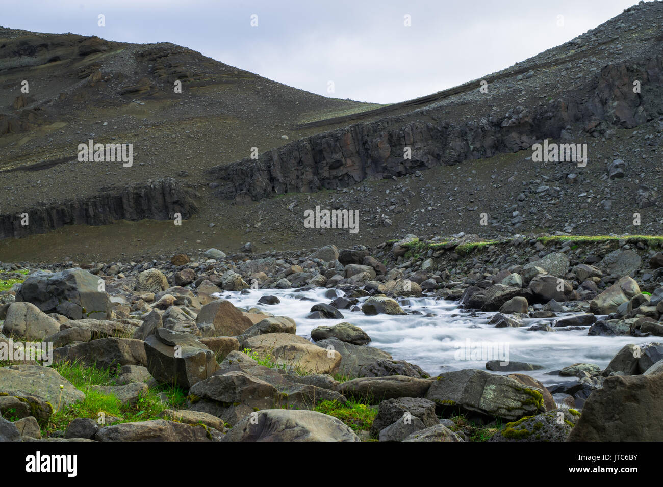 Basalt rock columns at the base of Litlanesfoss Waterfall, Iceland Stock Photo