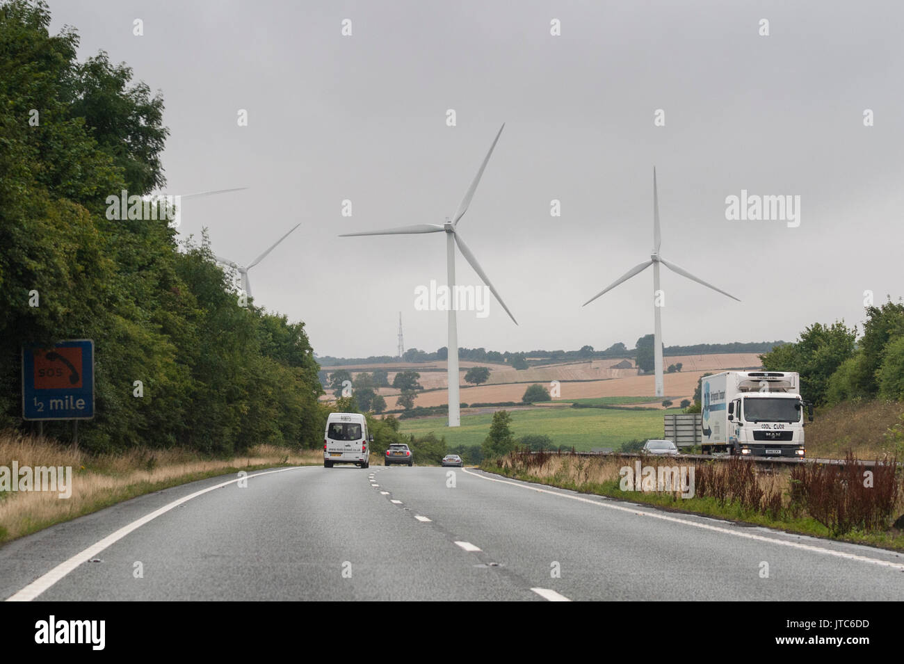 Wind Turbines seen from a main road in the Uk Stock Photo