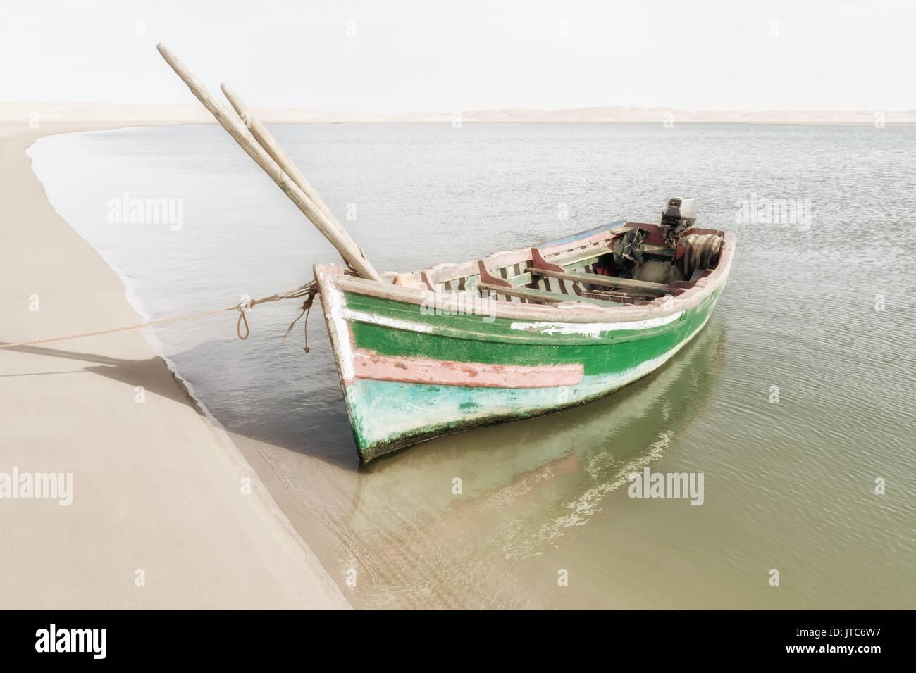 Beach with sand dunes and boat. High key, Instagram feeling image with muted colors. Stock Photo