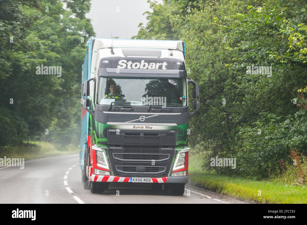 A Volvo Eddie Stobart HGV Lorry driving on a main road in the Uk Stock Photo