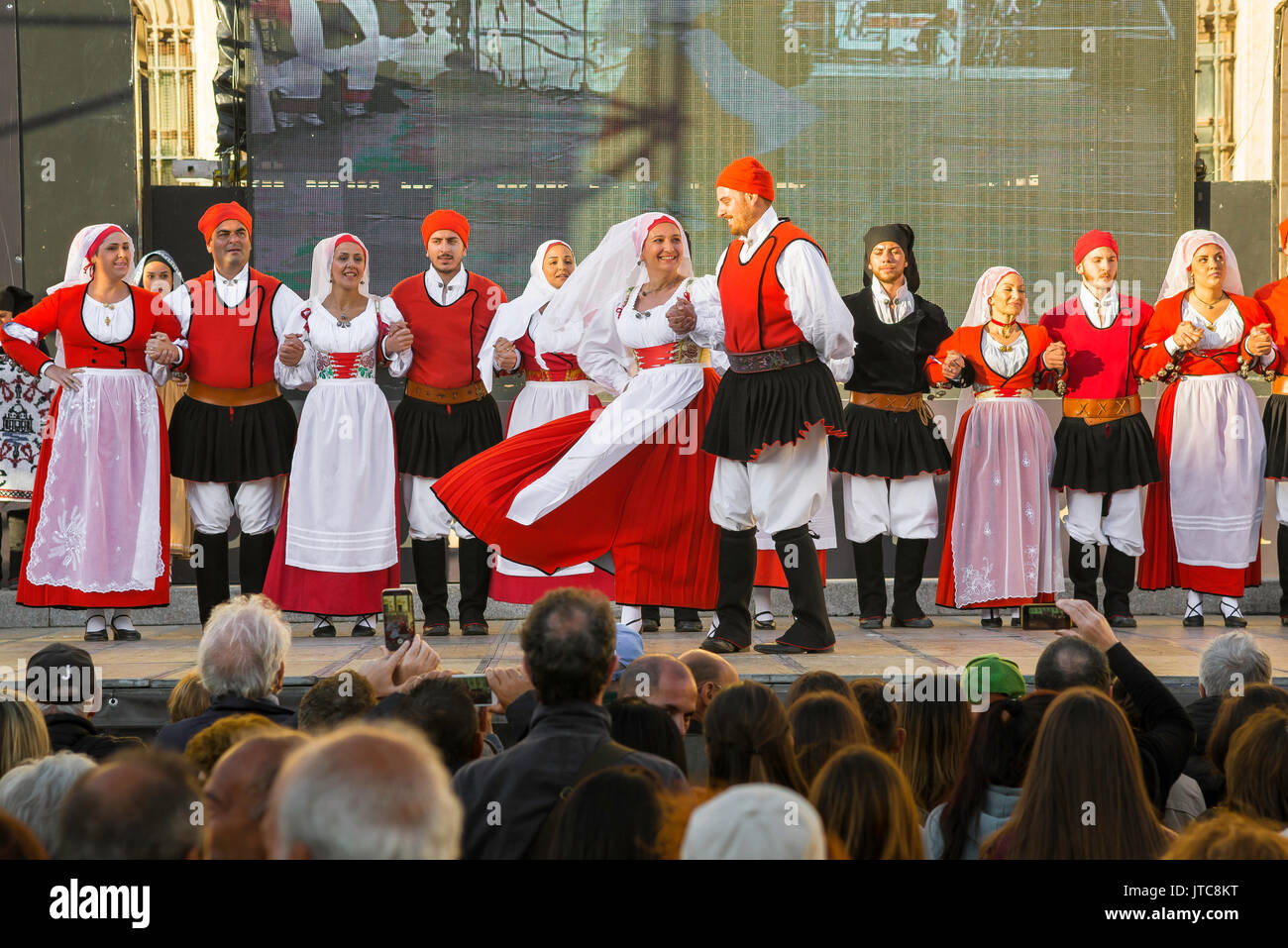 Sardinia folk festival, a traditional folk dance group perform on stage in the  Cavalcata festival in Sassari, Sardinia. Stock Photo
