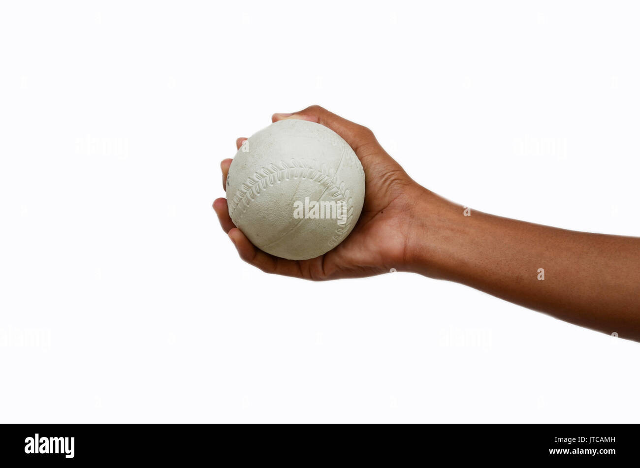softballl in hand on white background Stock Photo