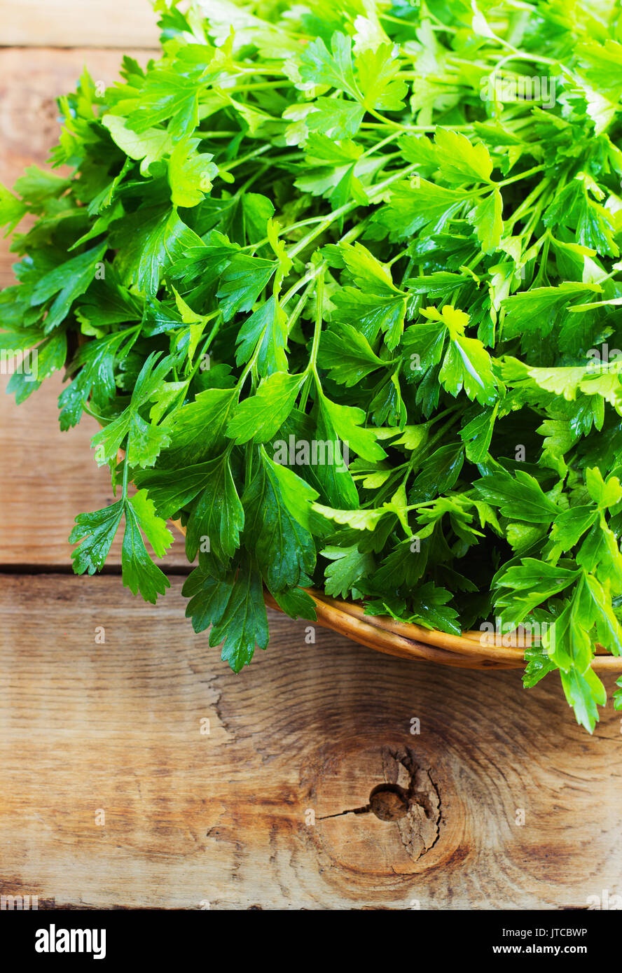 Fresh green parsley on wooden old background Stock Photo