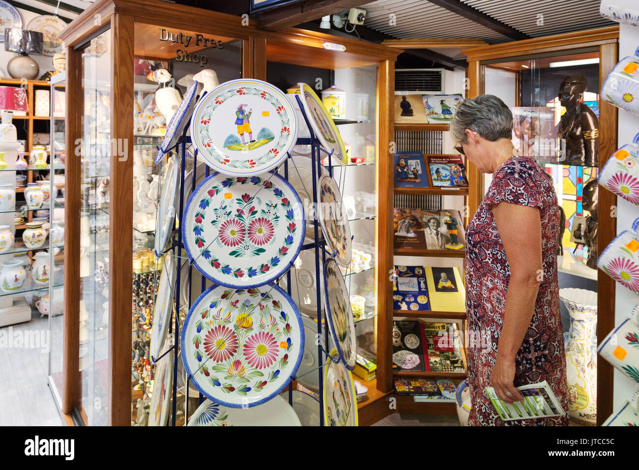 Quimper pottery, Brittany France people buying pottery in a shop