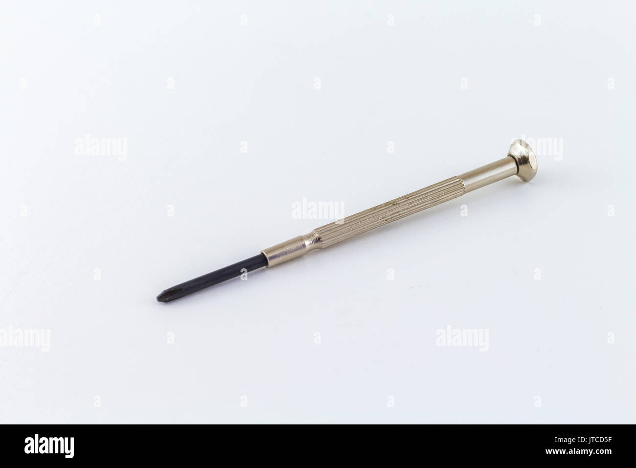 screwdriver mini tool on a white background chromed steel with crosshead tip Stock Photo