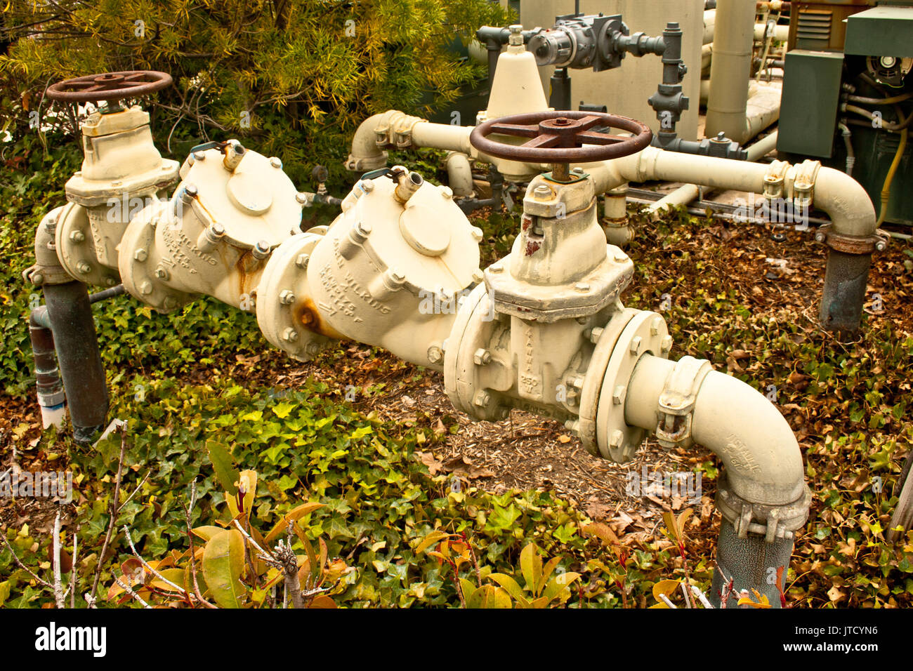 Big white plumbing pipes with rusty connections Stock Photo Alamy