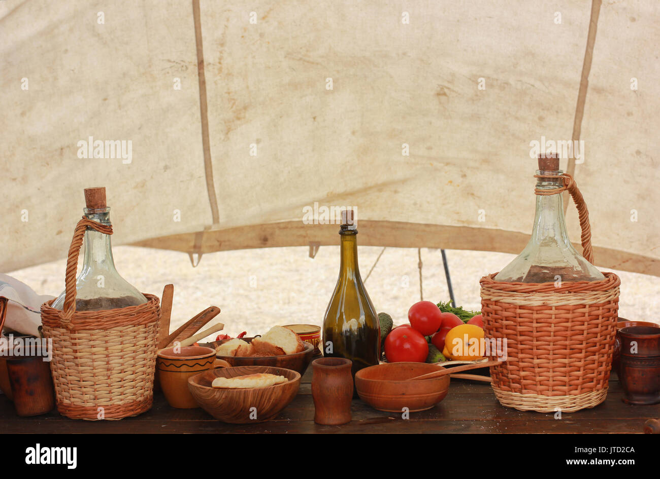 picnic table set with dishes and food Stock Photo Alamy