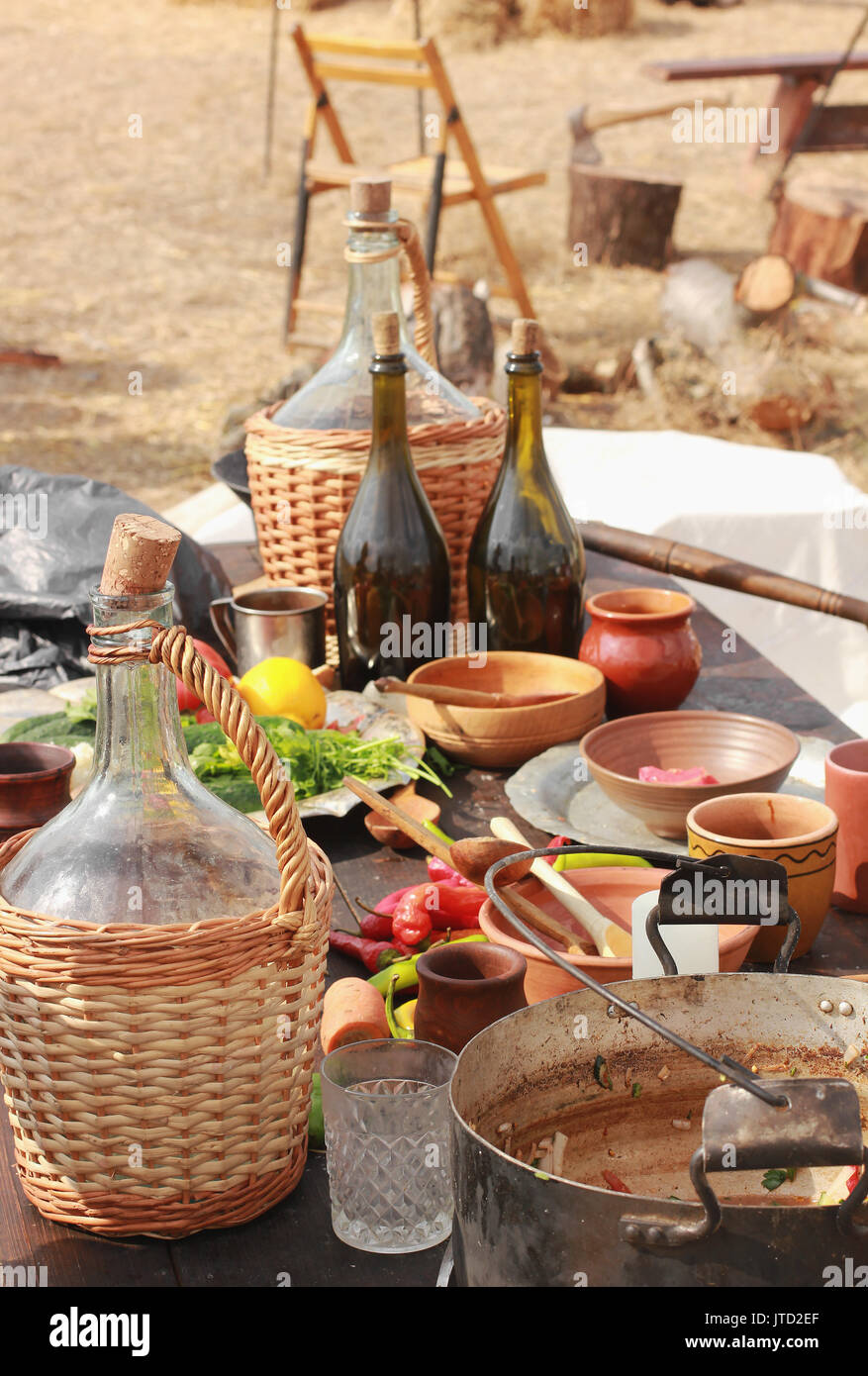 picnic table set with dishes and food Stock Photo Alamy