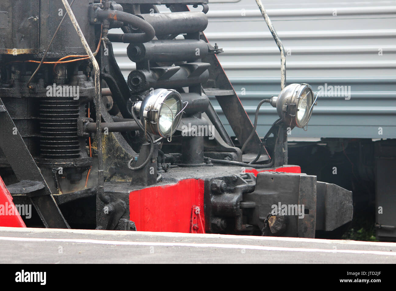 Powerful lights of old stands on the railroad tracks on the