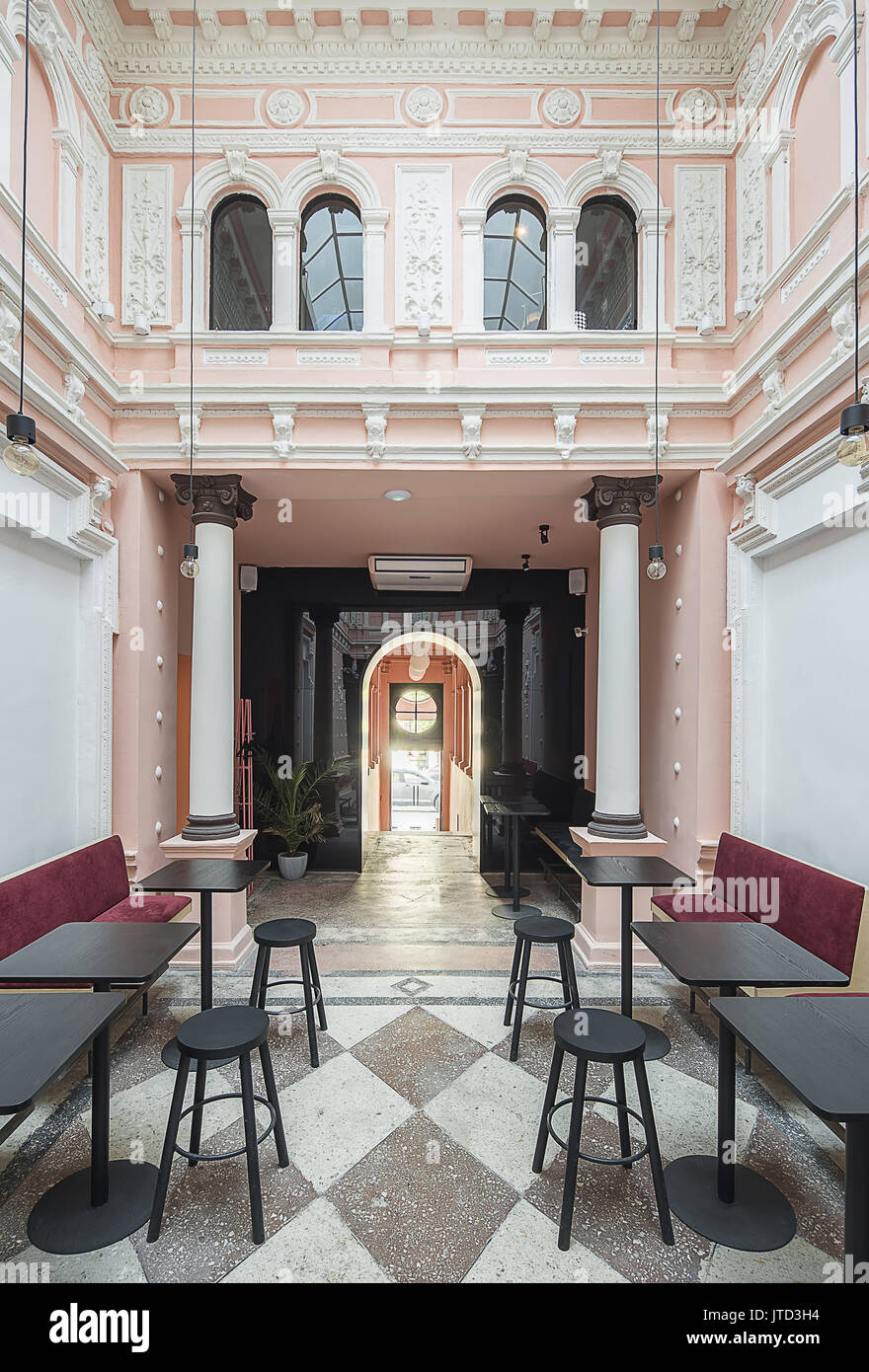 Antique Restaurant With White Stucco Molding On The Pink