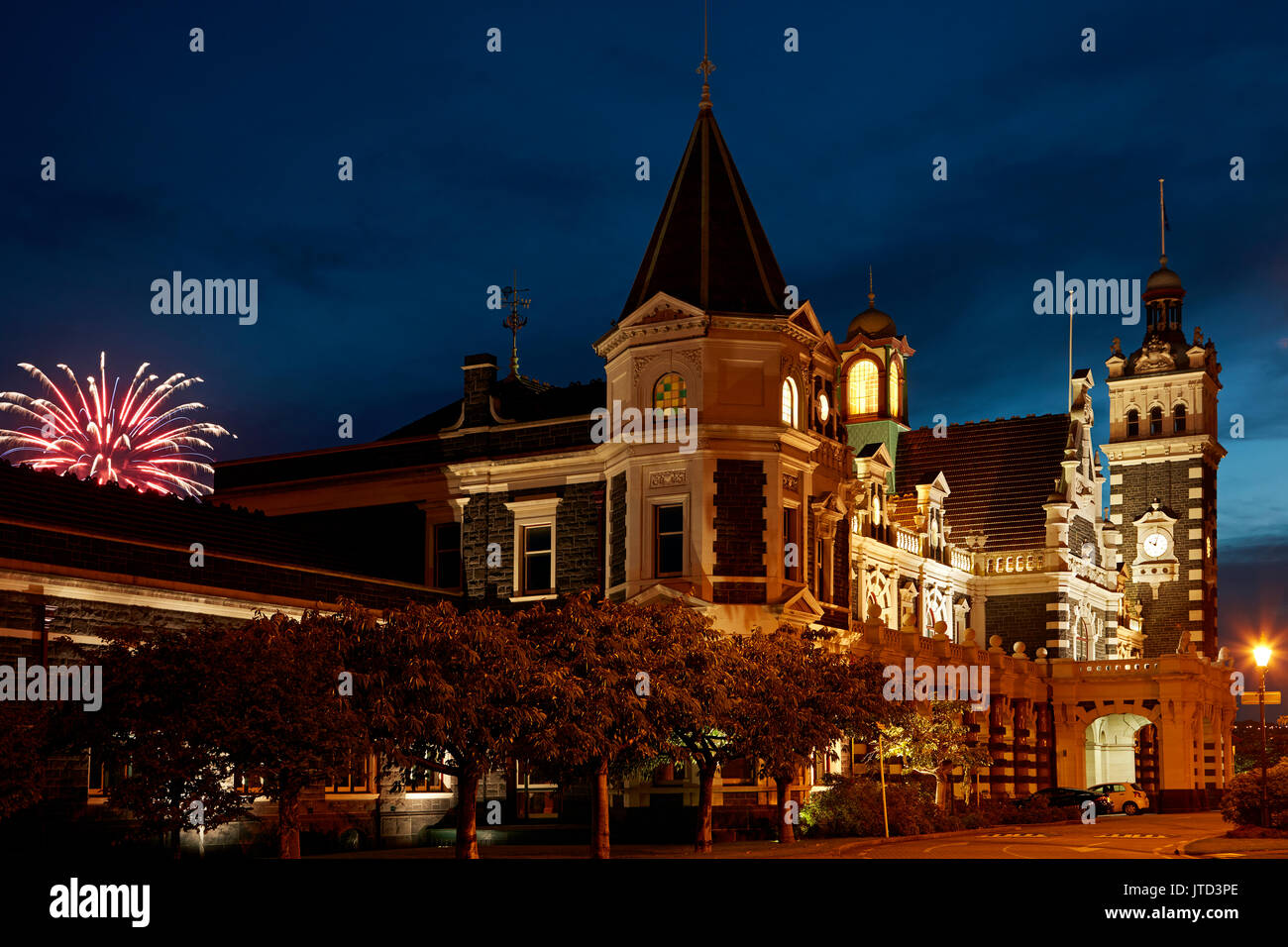 Historic Railway Station and fireworks, Dunedin, South Island, New Zealand Stock Photo