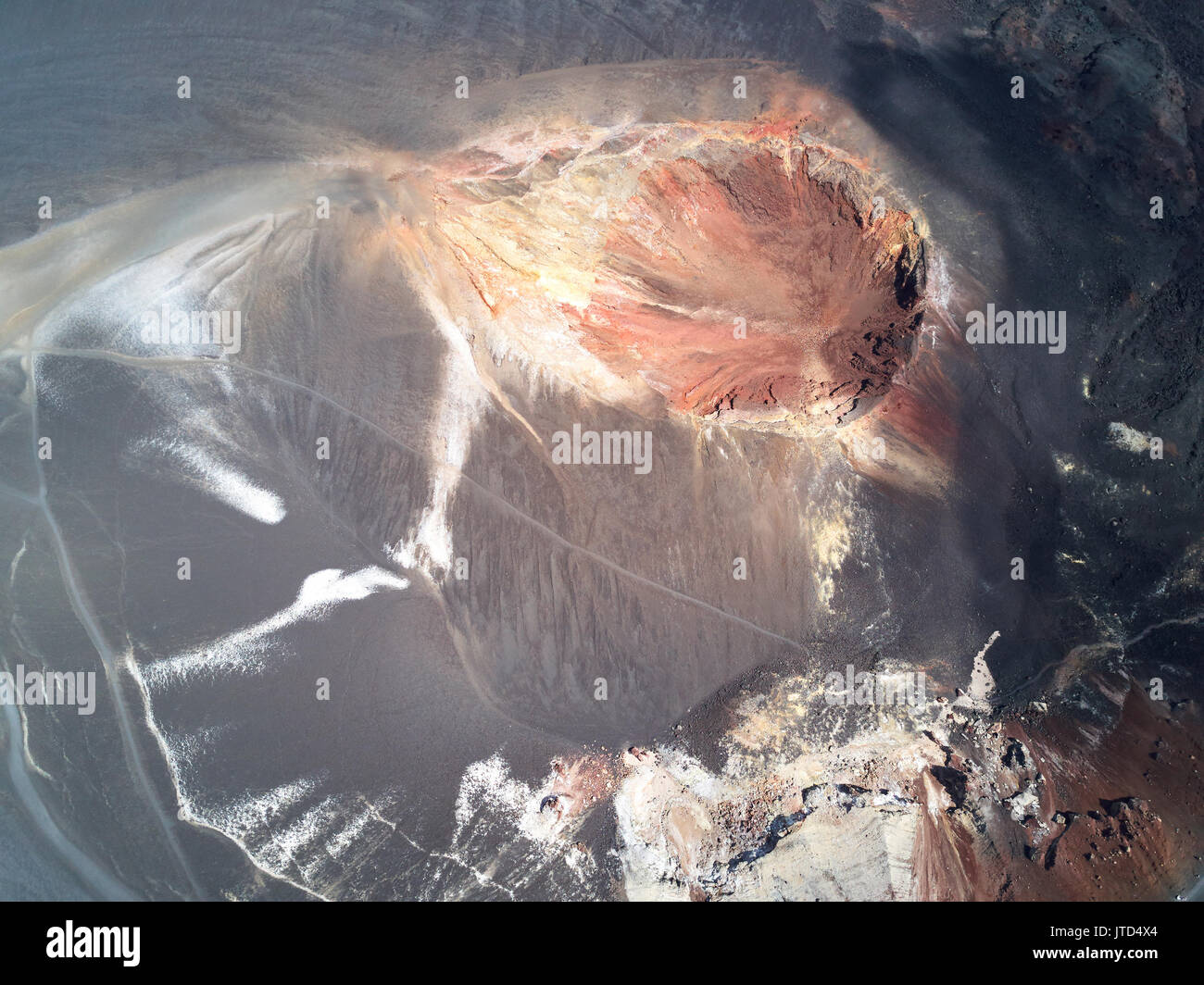 Hard for life planet surface above view. Big volcano crater Stock Photo