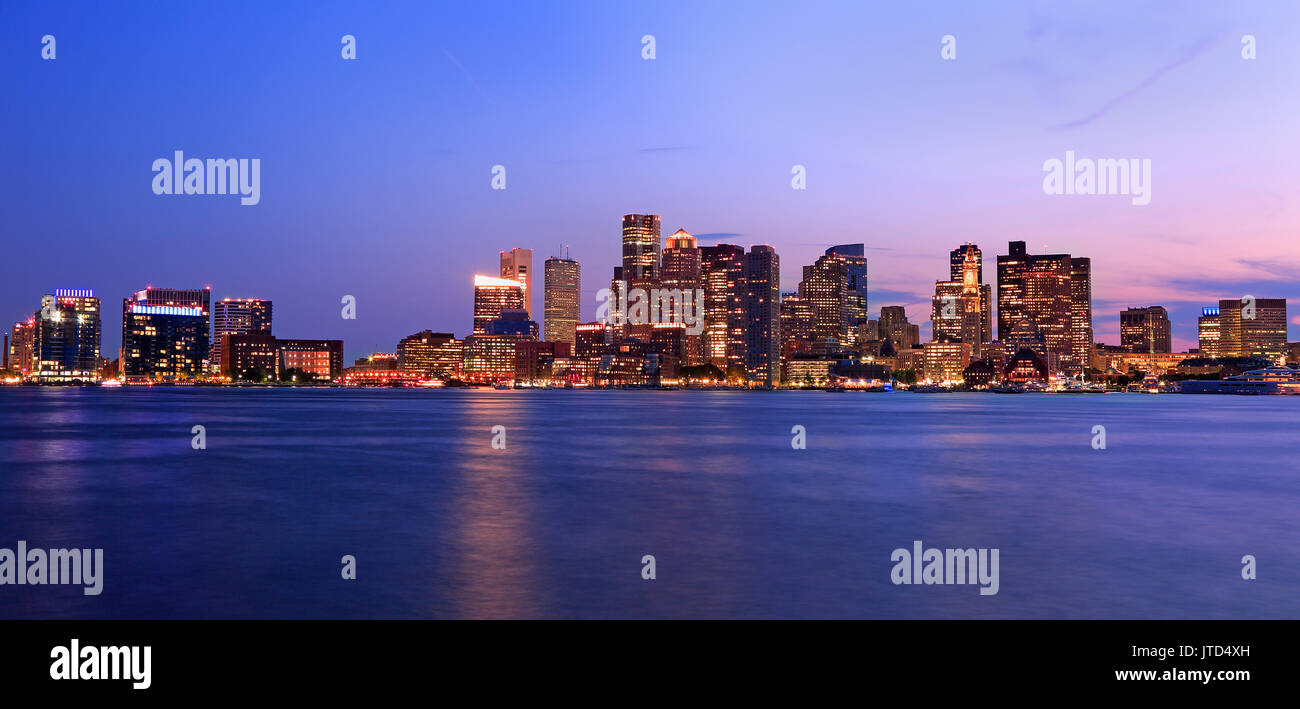 Boston skyline illuminated at night, USA Stock Photo