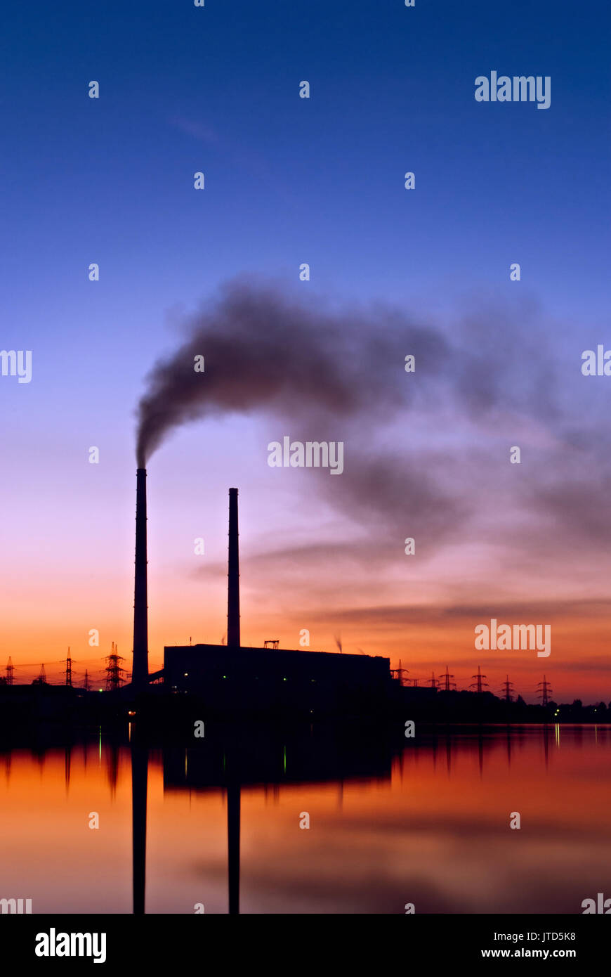 smoke from the chimney of the plant pollute Stock Photo