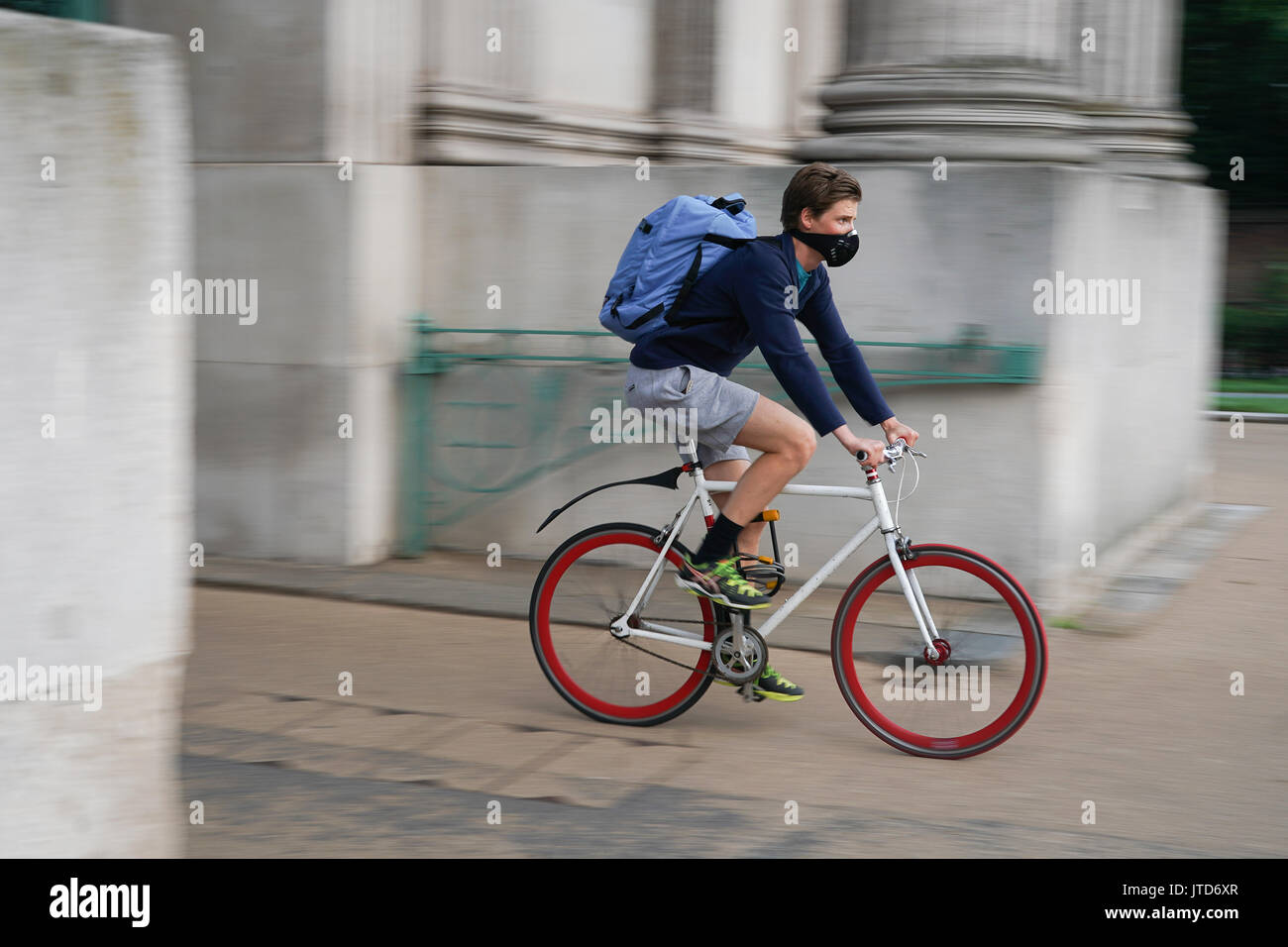 A view of a cyclist riding a single-speed fixed-wheel bike, or fixie, in Hyde Park Corner in London, UK. Photo date: Thursday, August 3, 2017. Photo c Stock Photo