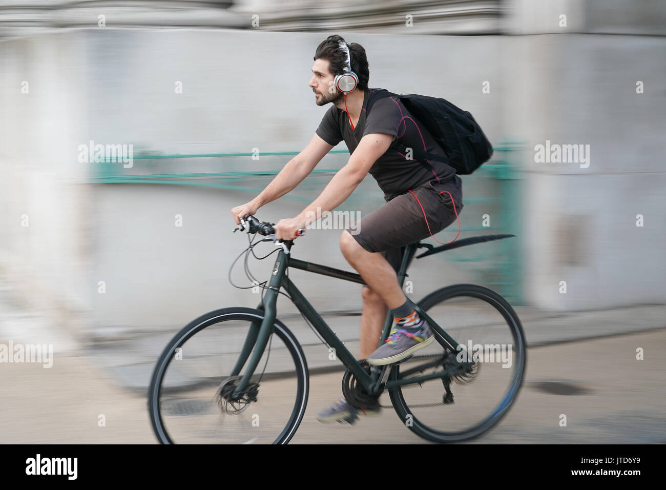 Cyclist headphones hi res stock photography and images Alamy