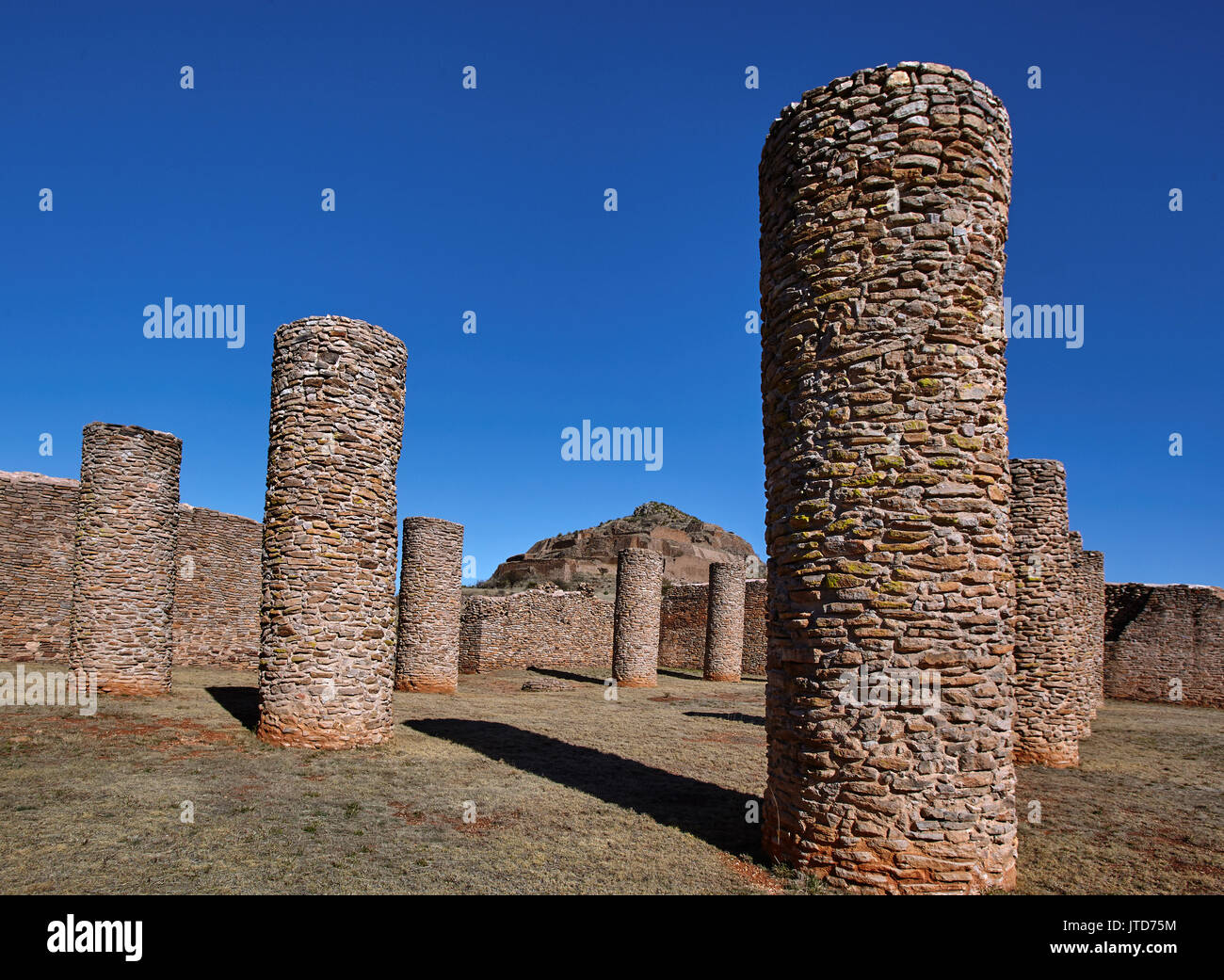 America; Mexico; Zacatecas; Malpaso valley;Pre hispanic; archaeological site La Quemada; Salón de las Columnas; Columns Hall. This 41 by 32 metre enclosure, probably reached a height of more than five metres before the fire that caused its destruction. In their interior eleven columns supported the roof. Until now its specific function is not known. Although works made in the 1950s indicate a ceremonial use possibly related to human sacrifice. Stock Photo